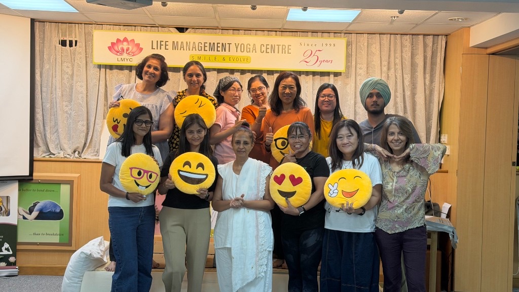 S.M.I.L.E. Ambassador graduates with certificates at Life Management Yoga Centre