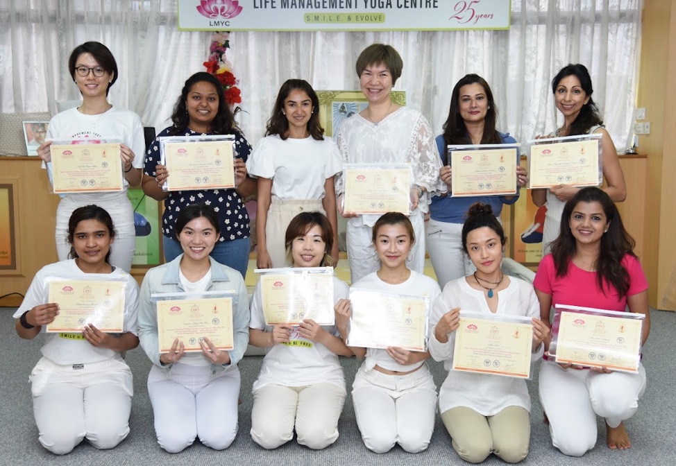 RYT 200 graduates with certificates at LMYC